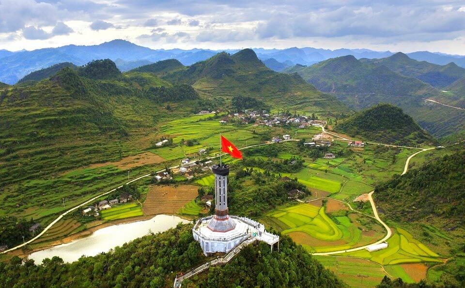 Aerial view of the Lung Cu Flag Tower, the northernmost point of Vietnam, overlooking the border landscape and ethnic villages in Ha Giang.